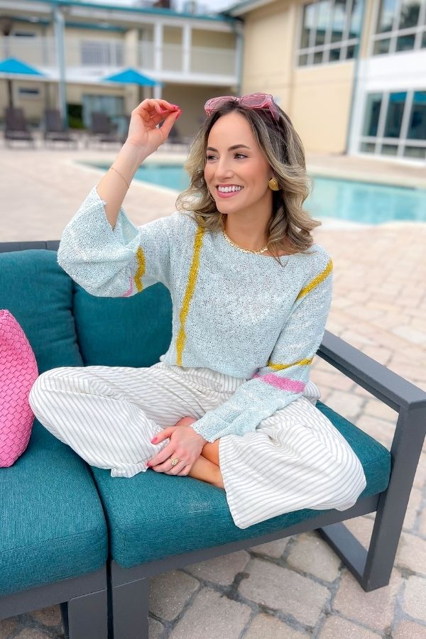 Baha Mint Stripe Beach Sweater featuring soft knit fabric and colorful stripes, ideal for layering. A breezy and chic choice for casual resort wear.