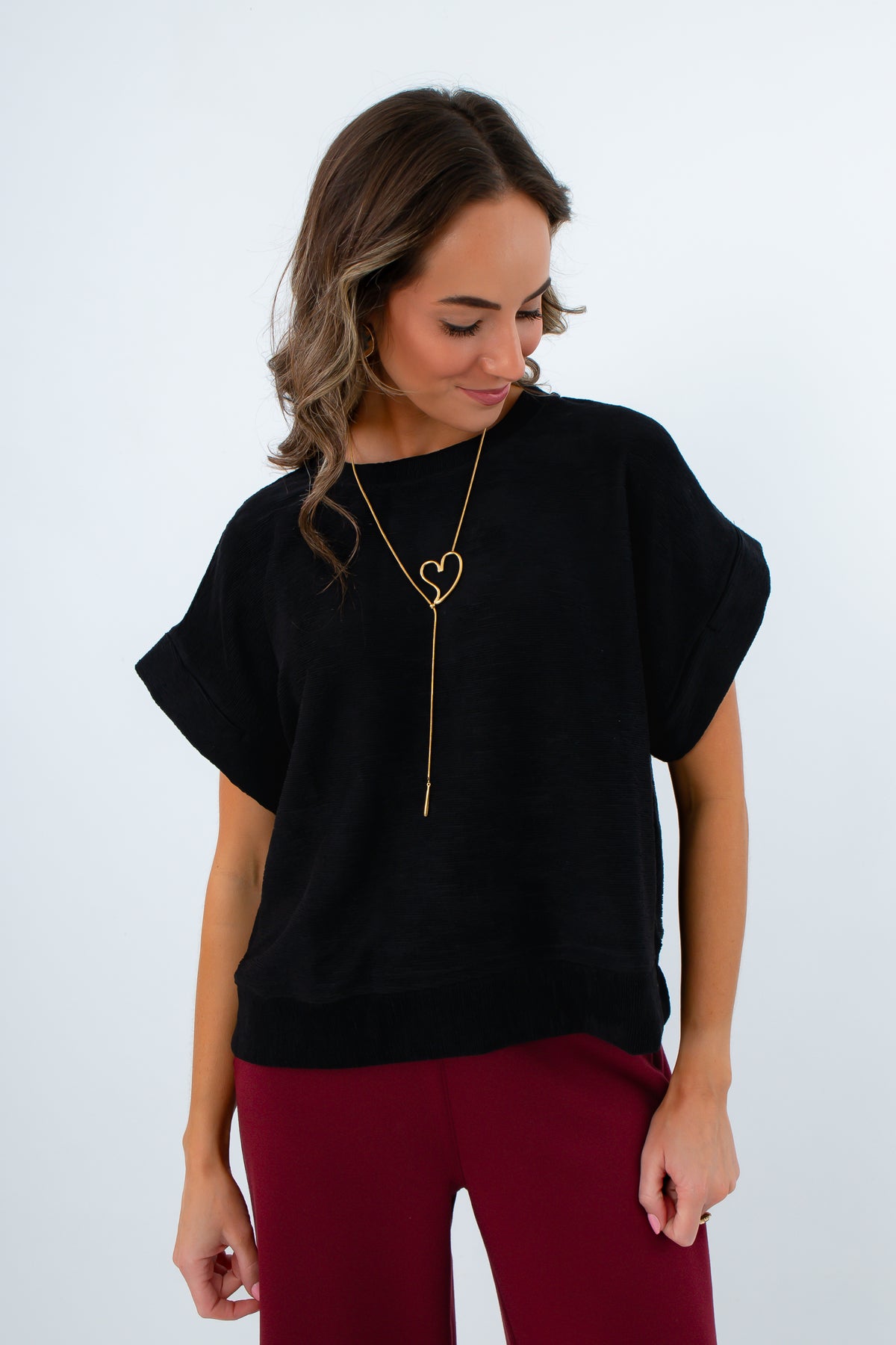Elevated basic black short sleeve knit shirt for casual and game day, black short sleeve top for work