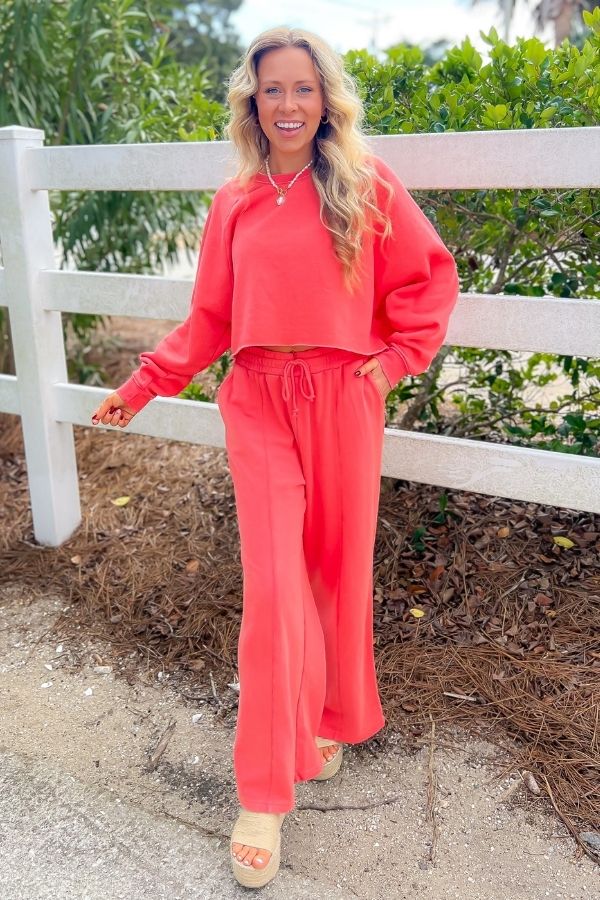 Trendy Coral Feeling Long Sleeve Crop Sweatshirt styled with matching wide-leg sweatpants, creating a chic and cozy resort-ready outfit.