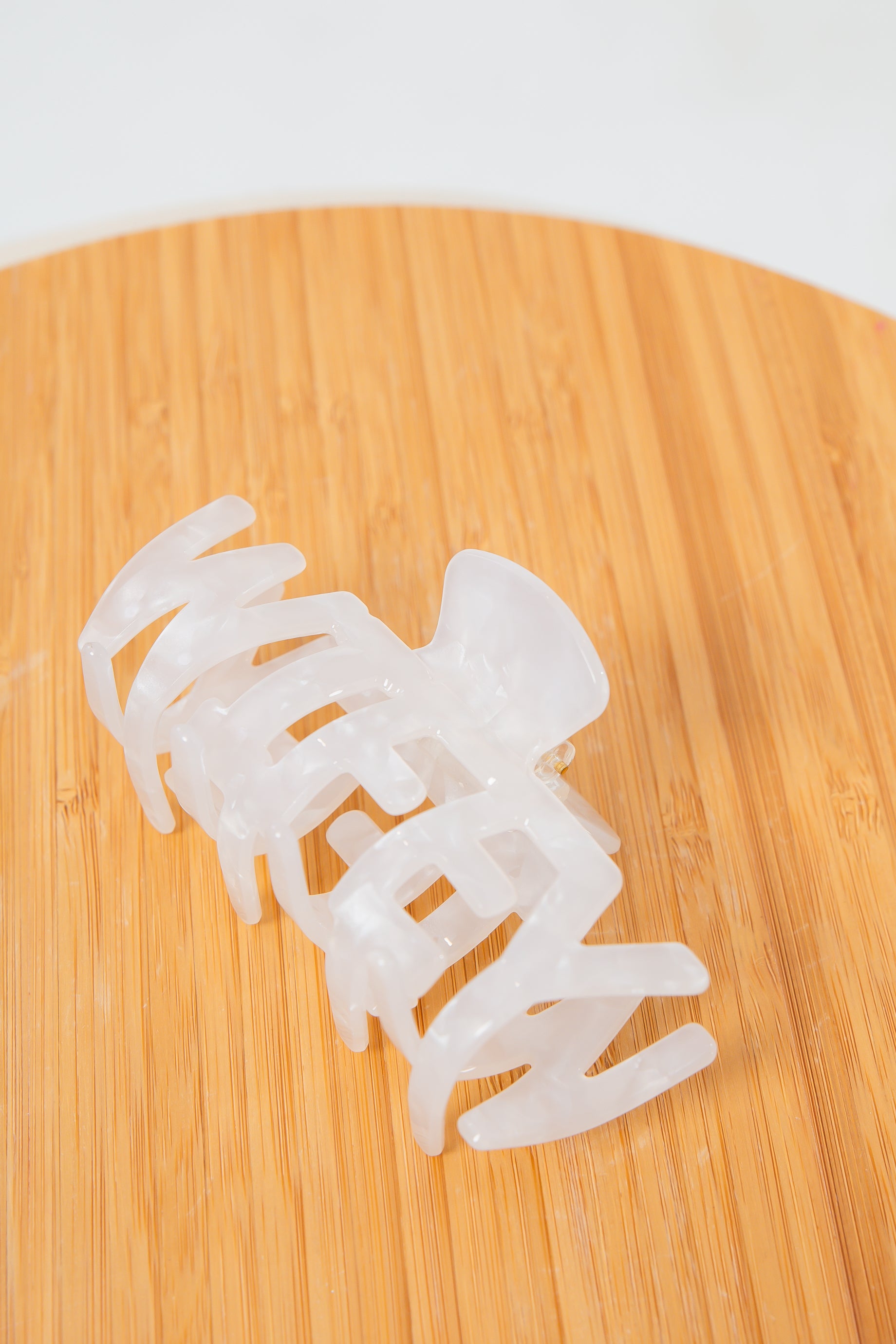 Close-up of Wifey Bridal Claw Clip on wooden background