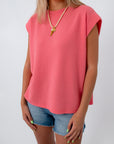 Close-up of pink coral knit top, sleeveless women's summer top