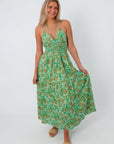 Green floral maxi dress with spaghetti straps, perfect for summer weddings and garden parties