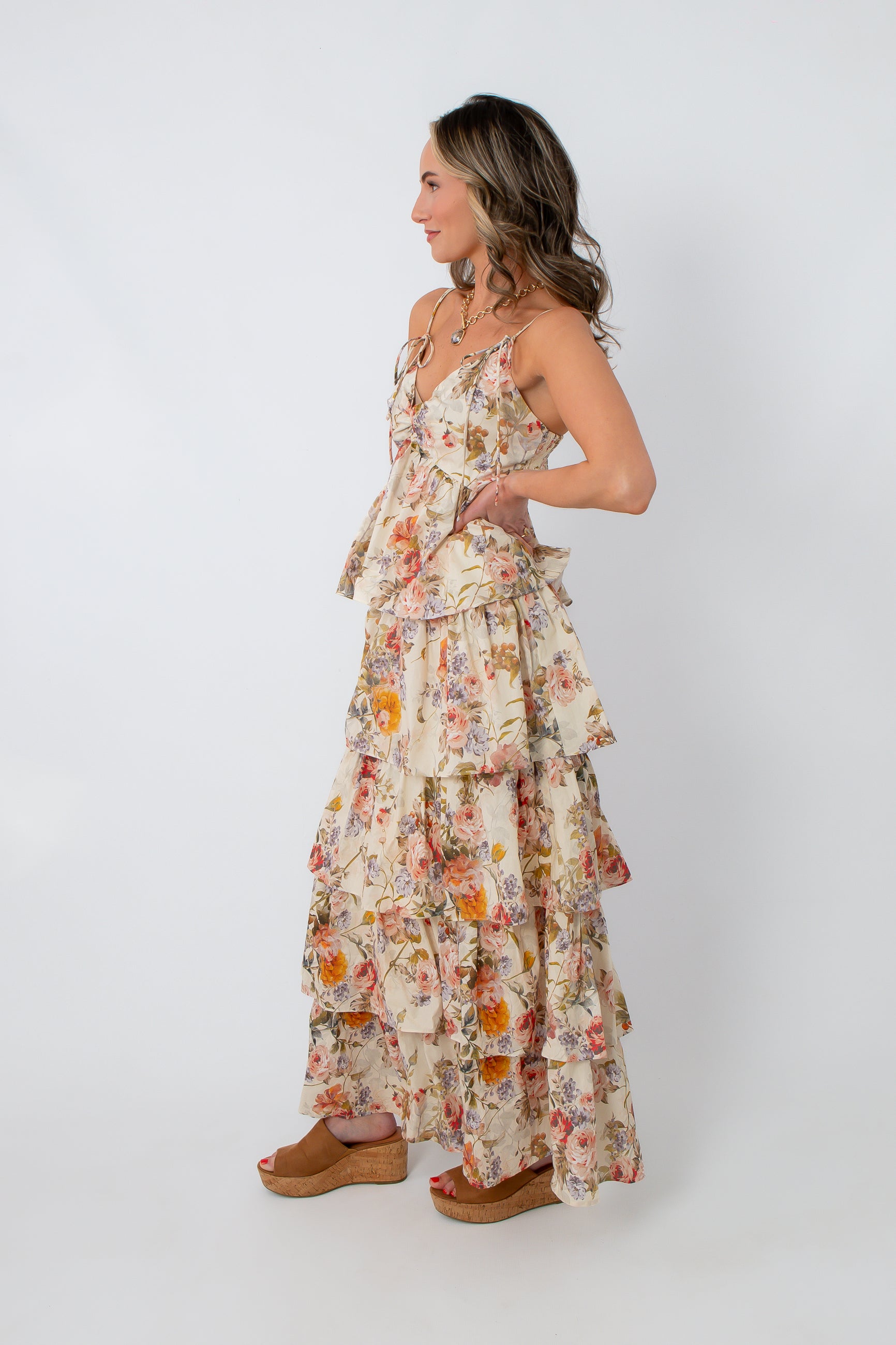 Side profile of floral wildflower tiered maxi dress with ruffles