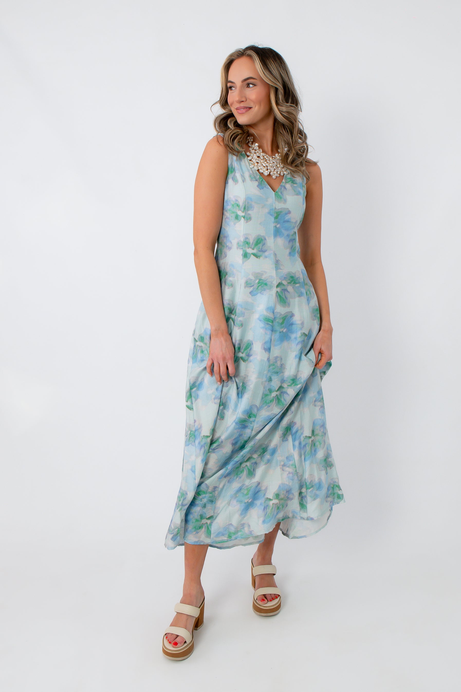 Back view of Watercolor Nymphéas Blue Floral Midi Dress with V-back and watercolor floral print, perfect for occasion wear