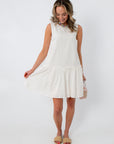 White cotton scallop hem mini dress with drop waist for spring and summer