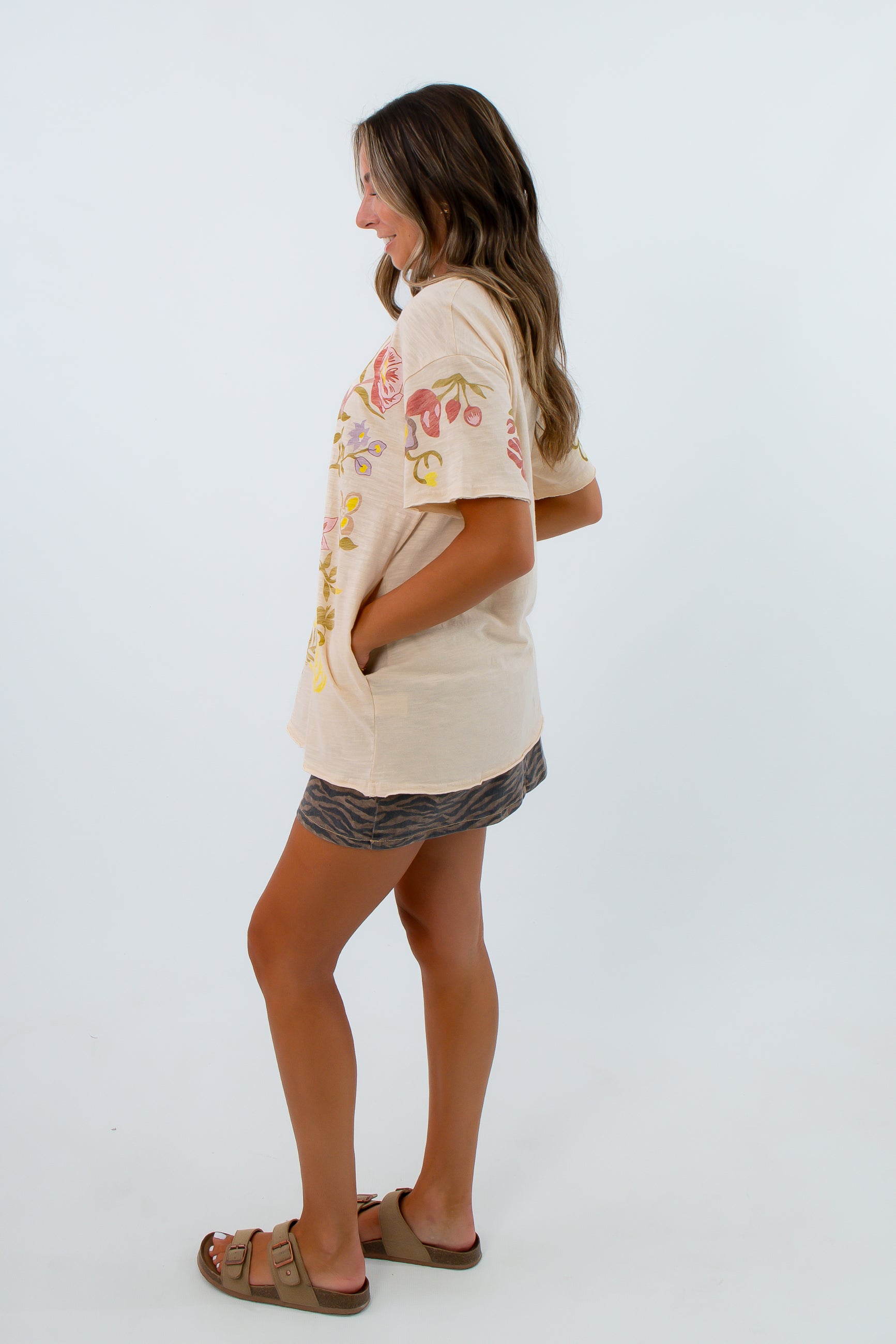 Lightweight beige t shirt with floral and butterfly print, oversized t shirt with floral design and side pockets