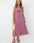 Pink gingham midi dress with bow detail for spring and summer fashion