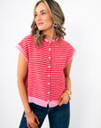Piper Pink Stripe Short Sleeve Cardigan with front button closure and ribbed hem, styled for spring layering in a lightweight knit.