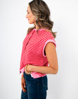 Side view of Piper Pink Stripe Short Sleeve Cardigan highlighting relaxed fit, cap sleeves, and soft knit texture for warm weather wear.