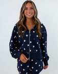 Navy and white polka dot jacket with dual zipper and side pockets, polka dot shorts set, navy and white matching lounge set