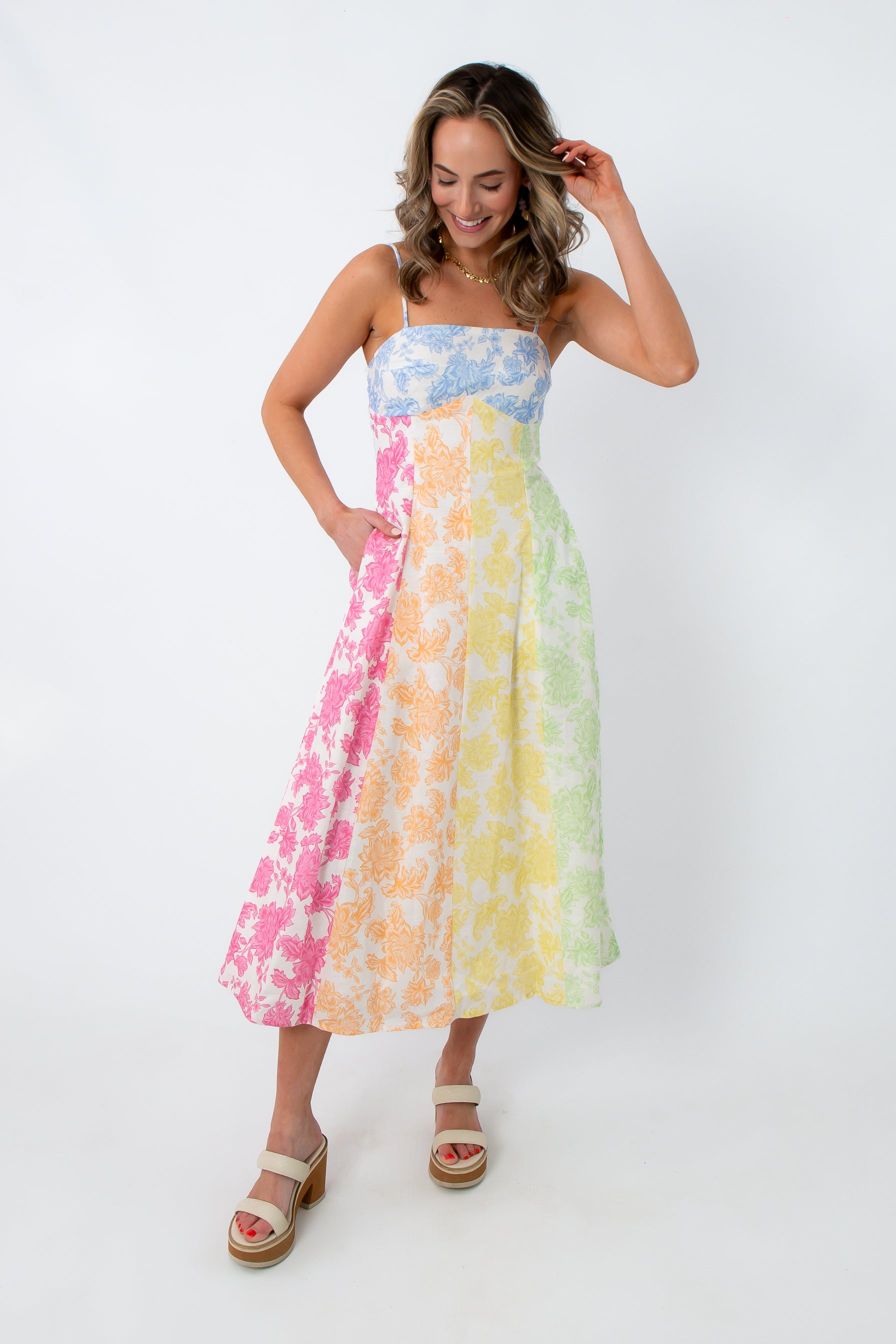 Colorful floral midi dress with spaghetti straps and pockets