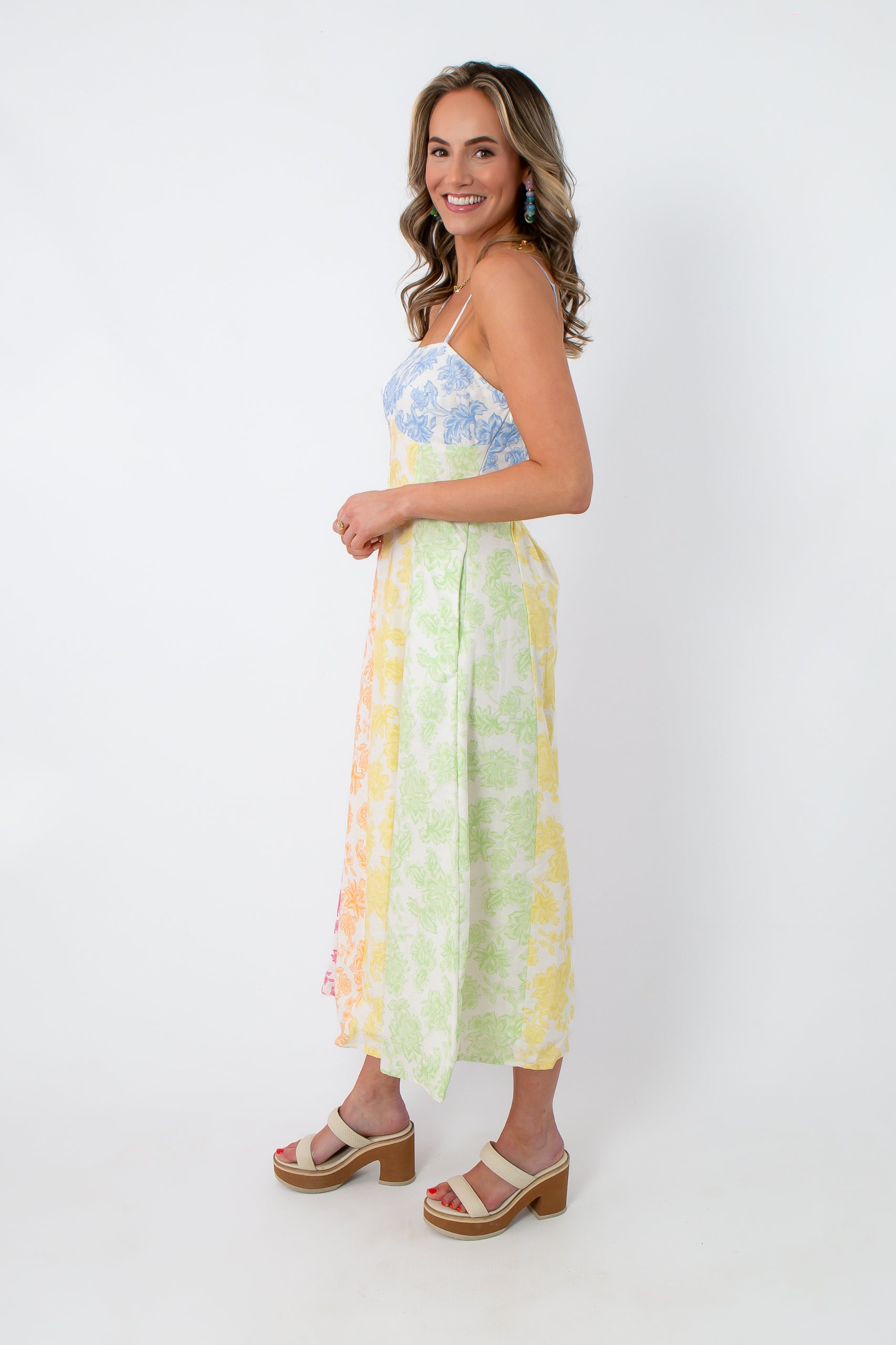 Back view of multicolor floral midi dress with smocked back and pockets