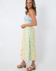 Back view of multicolor floral midi dress with smocked back and pockets