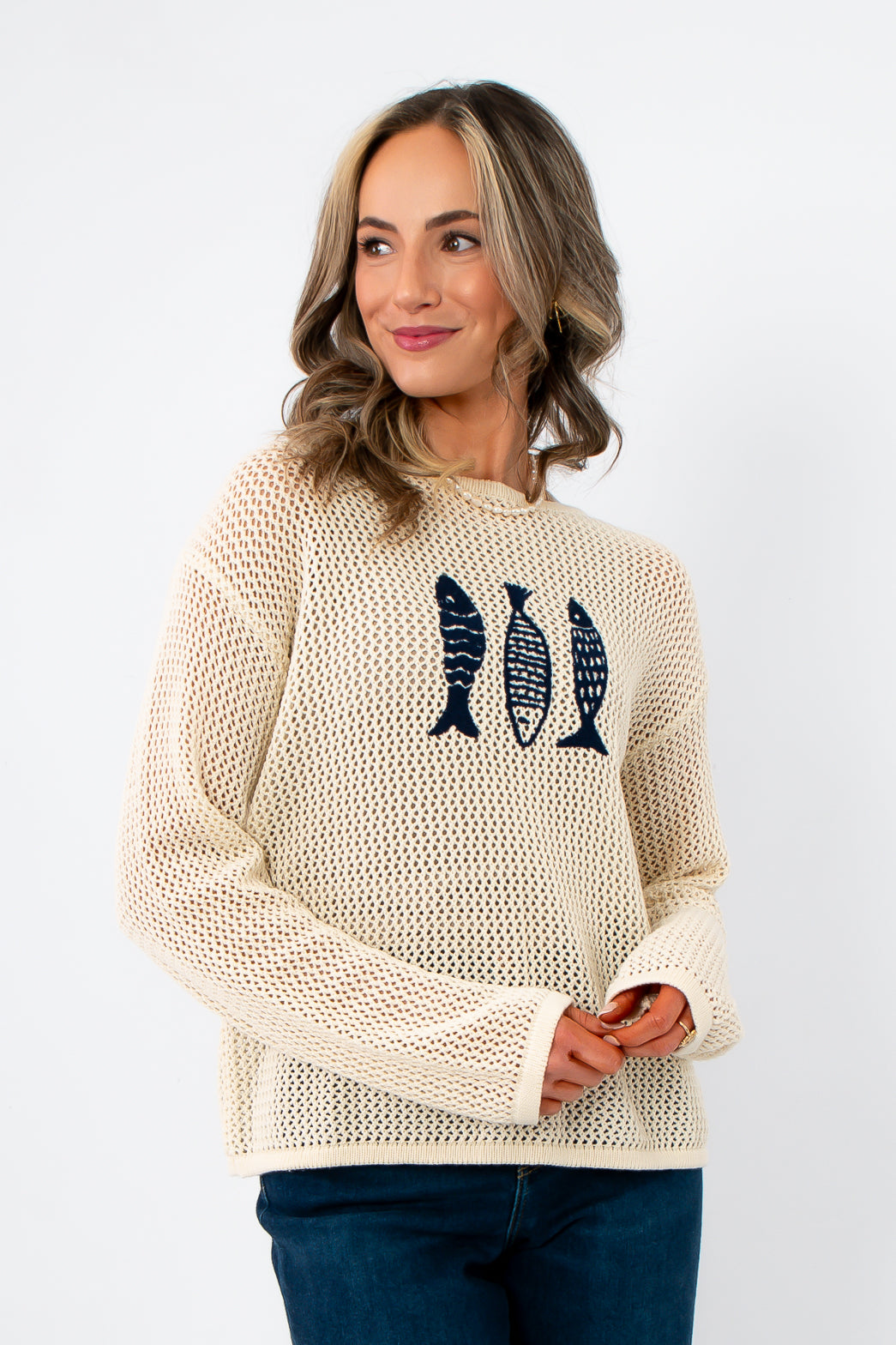 Beachcomber Navy Fish Embroidered Sweater in cream mesh knit with navy fish design, styled for a trendy and casual beachwear look.