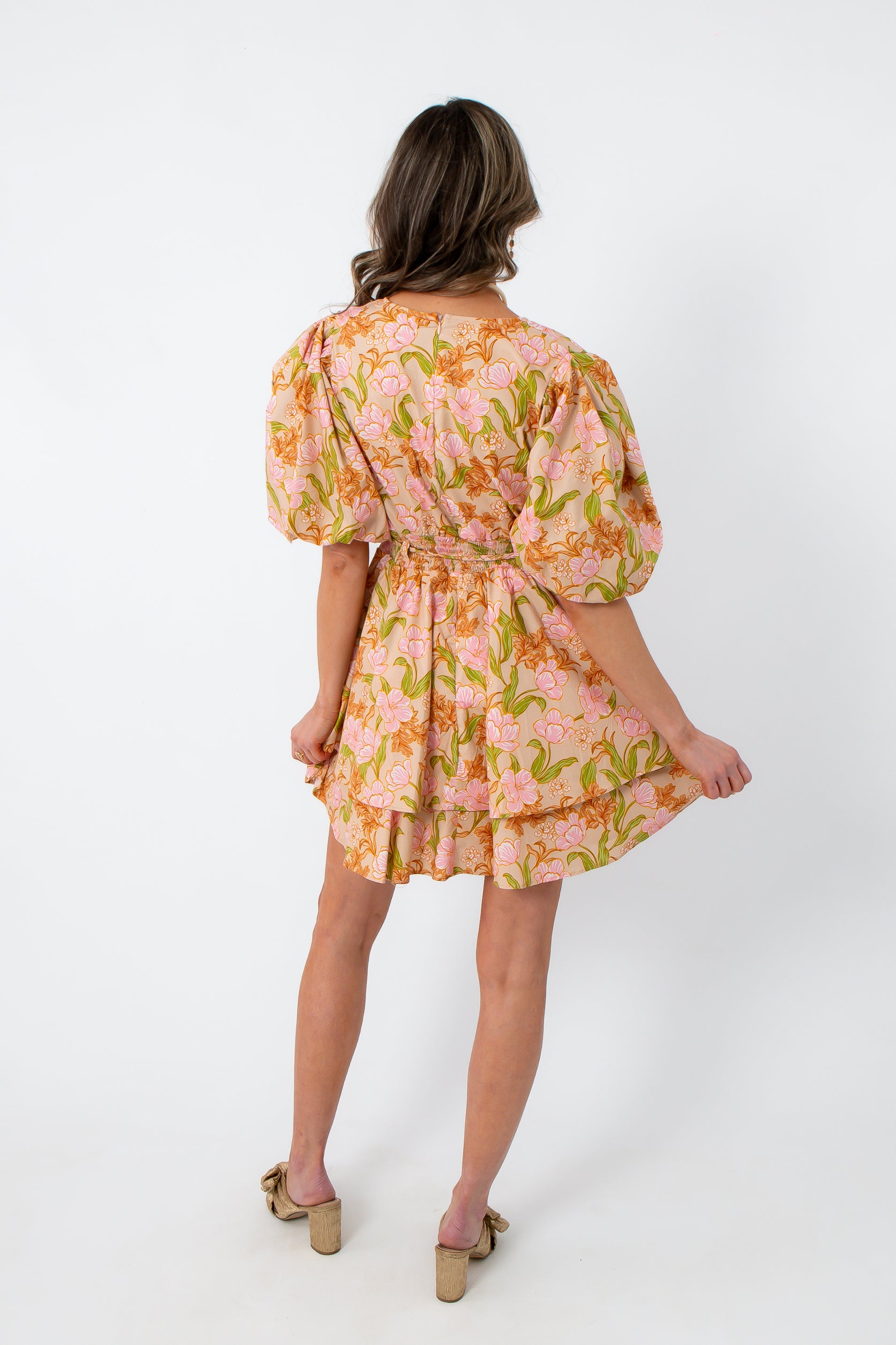 Floral mini dress with pink and orange tulip print, puff sleeves, and cinched waist, perfect for spring casual wear