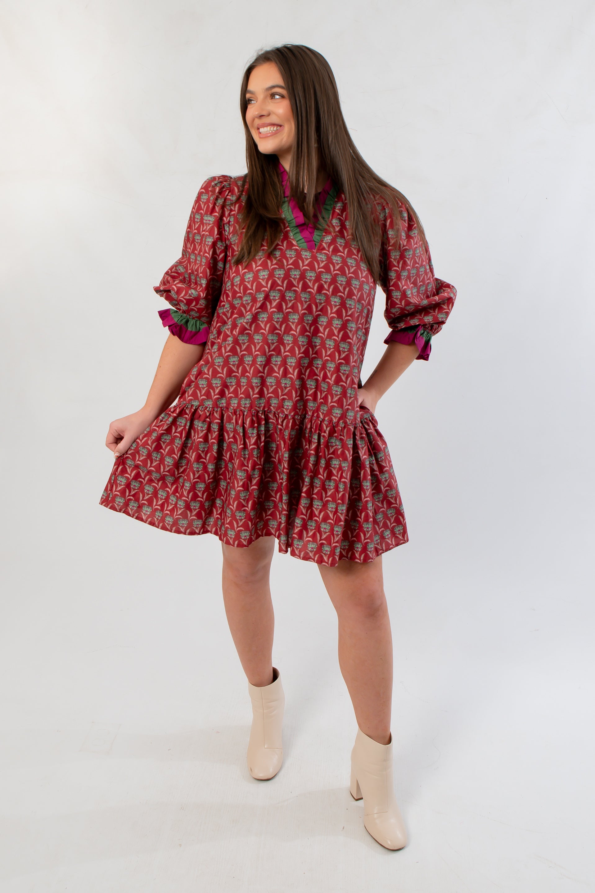 Holiday-ready Mulberry Mistletoe Block Print Dress featuring a tiered skirt, bold seasonal print, and southern-inspired charm.