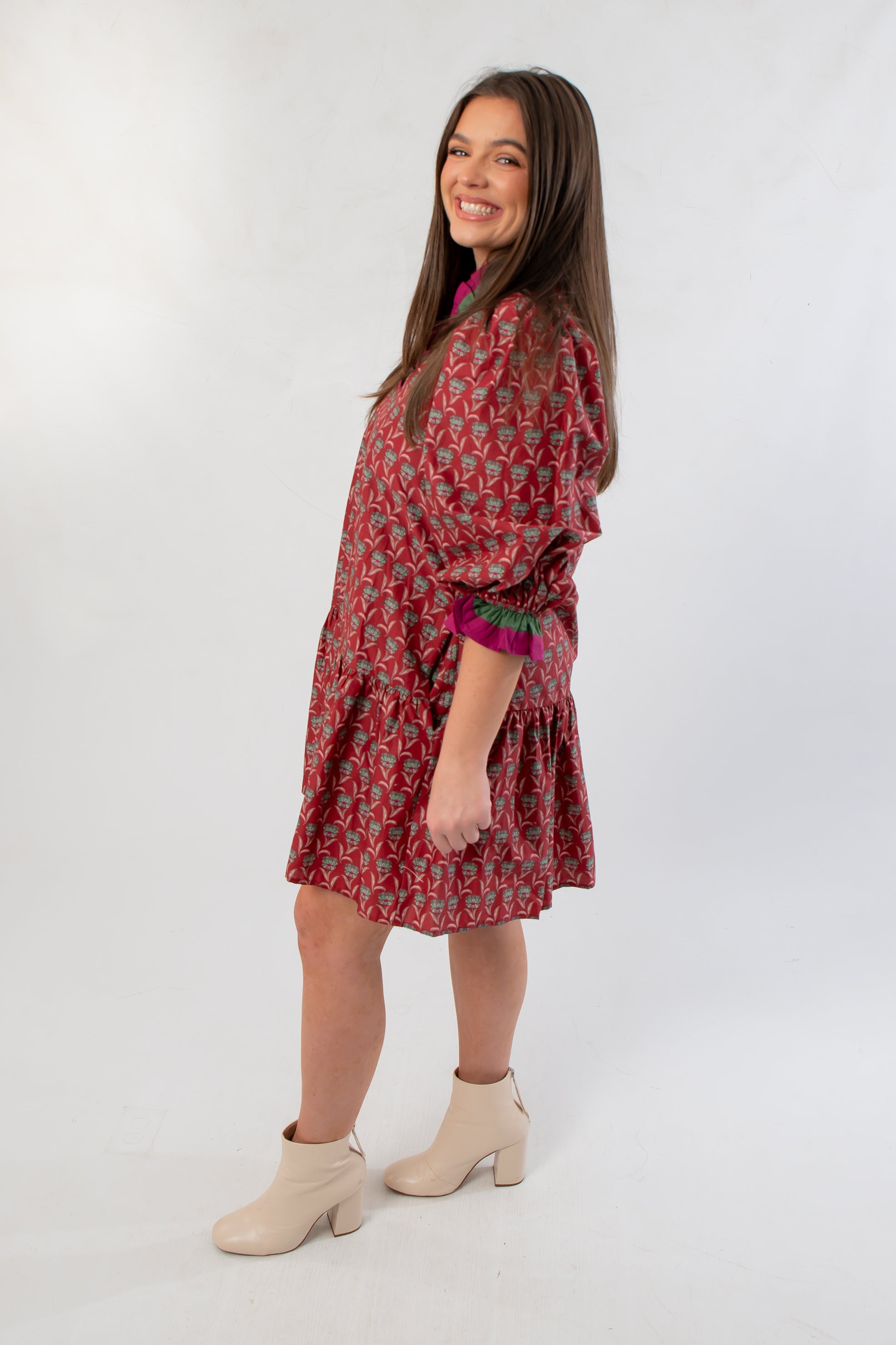 Side view of Mulberry Mistletoe Block Print Dress showing puff sleeves, relaxed fit, and playful silhouette perfect for casual holiday events.
