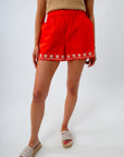 Embroidered shell border shorts in red