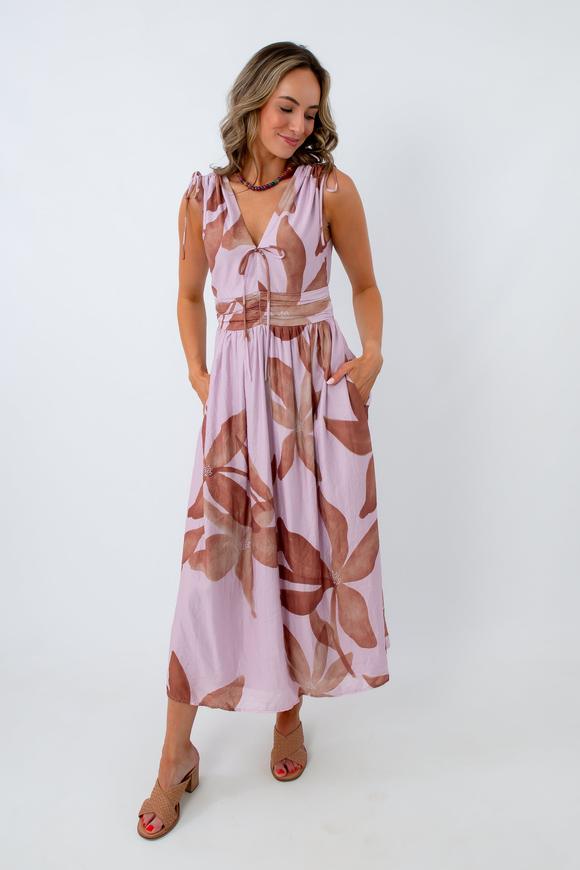 lilac and brown floral printed midi dress styled for summer getaway