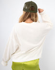 Back view of Sea La Vie Beach Icons Sweatshirt in white, highlighting its relaxed fit and soft fabric for casual comfort.