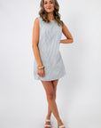 Palmetto Pier Blue Stripe Mini Dress features a sleeveless design with vertical blue stripes, ideal for lightweight summer style and casual wear.