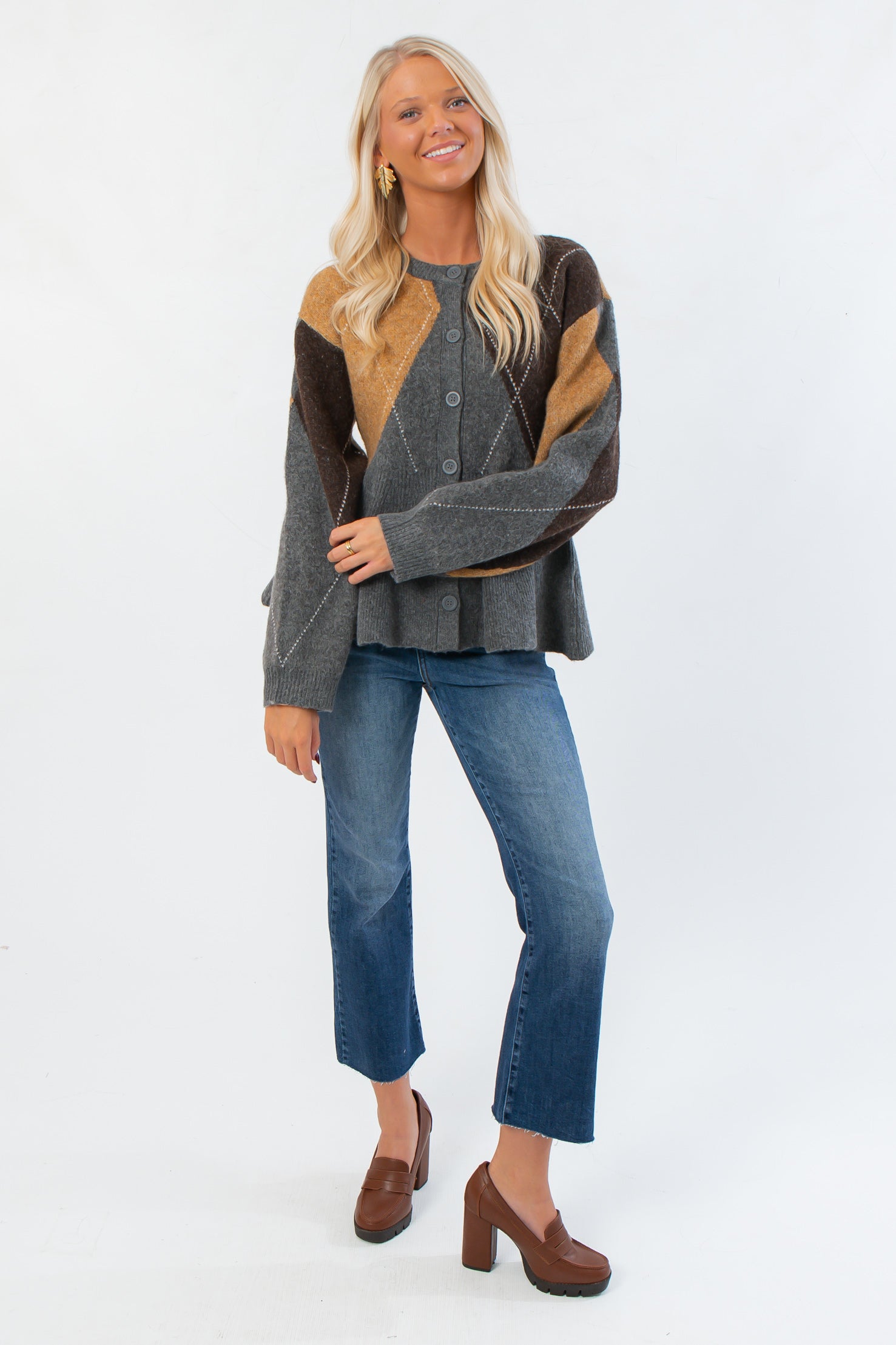 Front view of Steve Madden Argyle Lillie Cardigan with button closure, ribbed cuffs, and relaxed fit, ideal for fall layering.