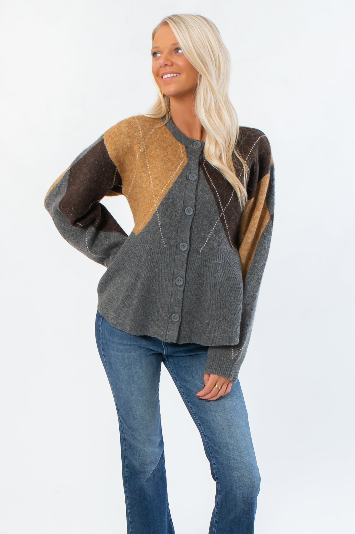 Steve Madden Argyle Lillie Cardigan in soft gray with brown and mustard argyle pattern, featuring a peplum hem and crewneck style.