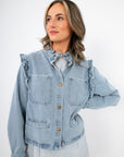 Stylish Women’s Ruffle-Trim Light Wash Denim Jacket featuring feminine ruffle shoulders and a lightweight fit for casual outerwear.