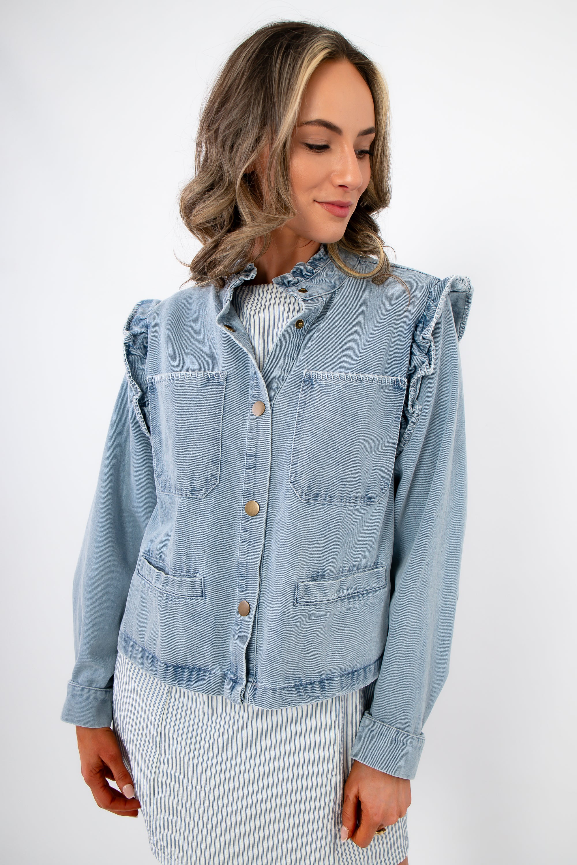 Ruffle-Trim Light Wash Denim Jacket– Stylish Women’s Blouse with front button closure and chest pockets, ideal for spring layering.