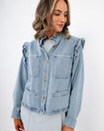 Ruffle-Trim Light Wash Denim Jacket– Stylish Women’s Blouse with front button closure and chest pockets, ideal for spring layering.