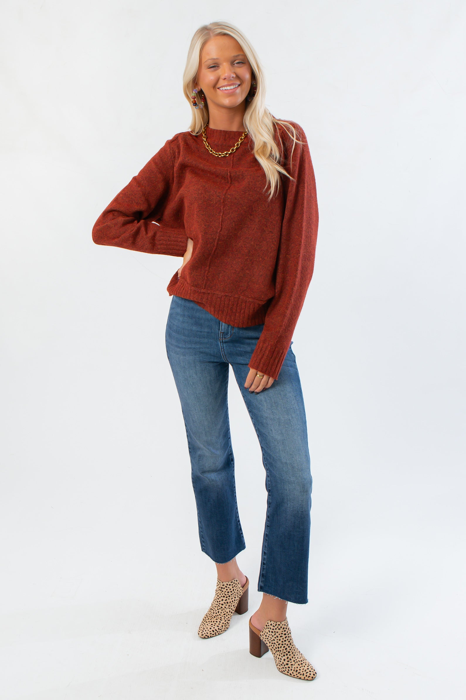 Cozy Take It Easy Rust Pullover Sweater paired with cropped jeans and leopard mules, perfect for a casual fall outfit.