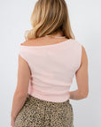 Back view of Friday Feeling Baby Pink Asymmetrical Knit Top featuring seamless knit texture and asymmetrical neckline for a chic spring look.