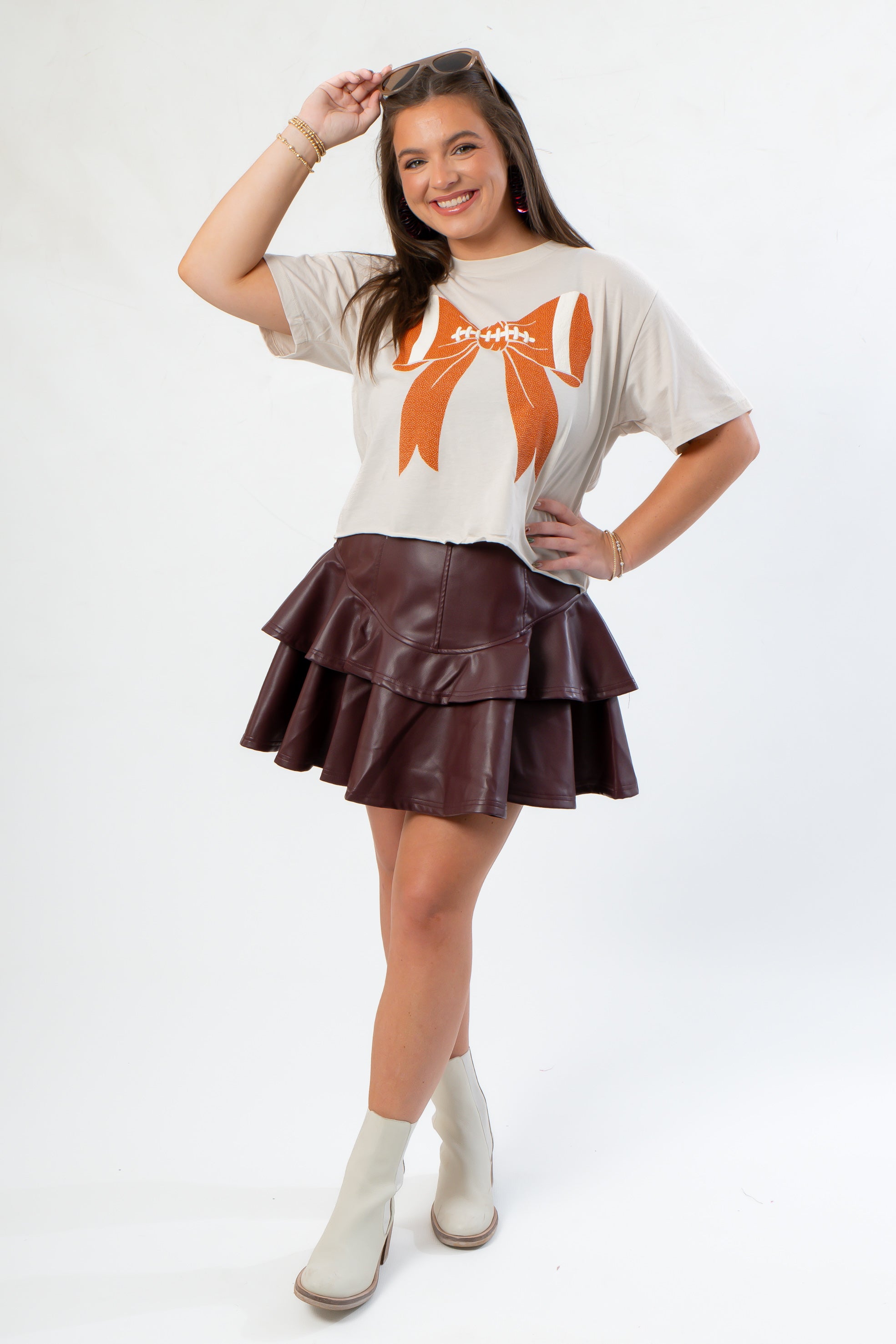 Sporty and stylish Bone Bow Crop Tshirt paired with a maroon tiered skirt, ideal for fans seeking a fashionable game day outfit.