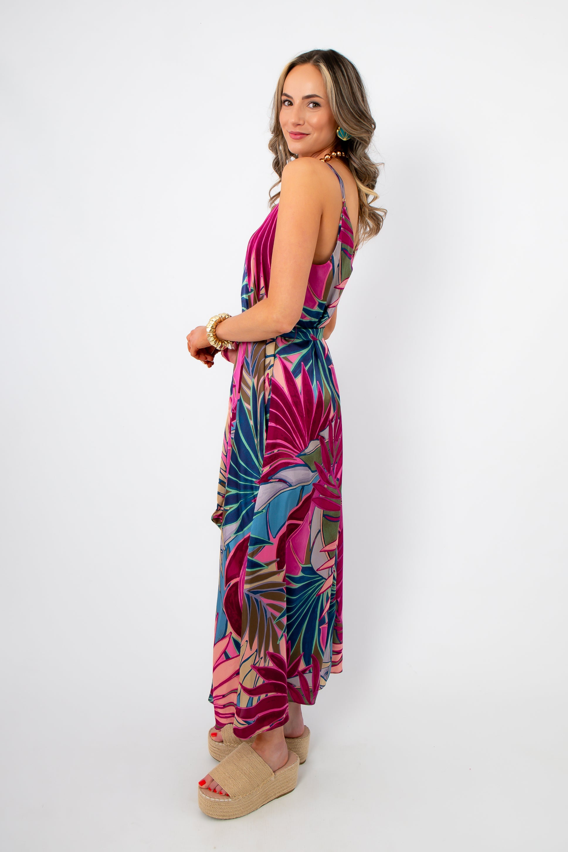 Side view of Tropical Jewel Satin Palm Print Maxi Dress showing flowy silhouette and adjustable straps for a flattering summer look.
