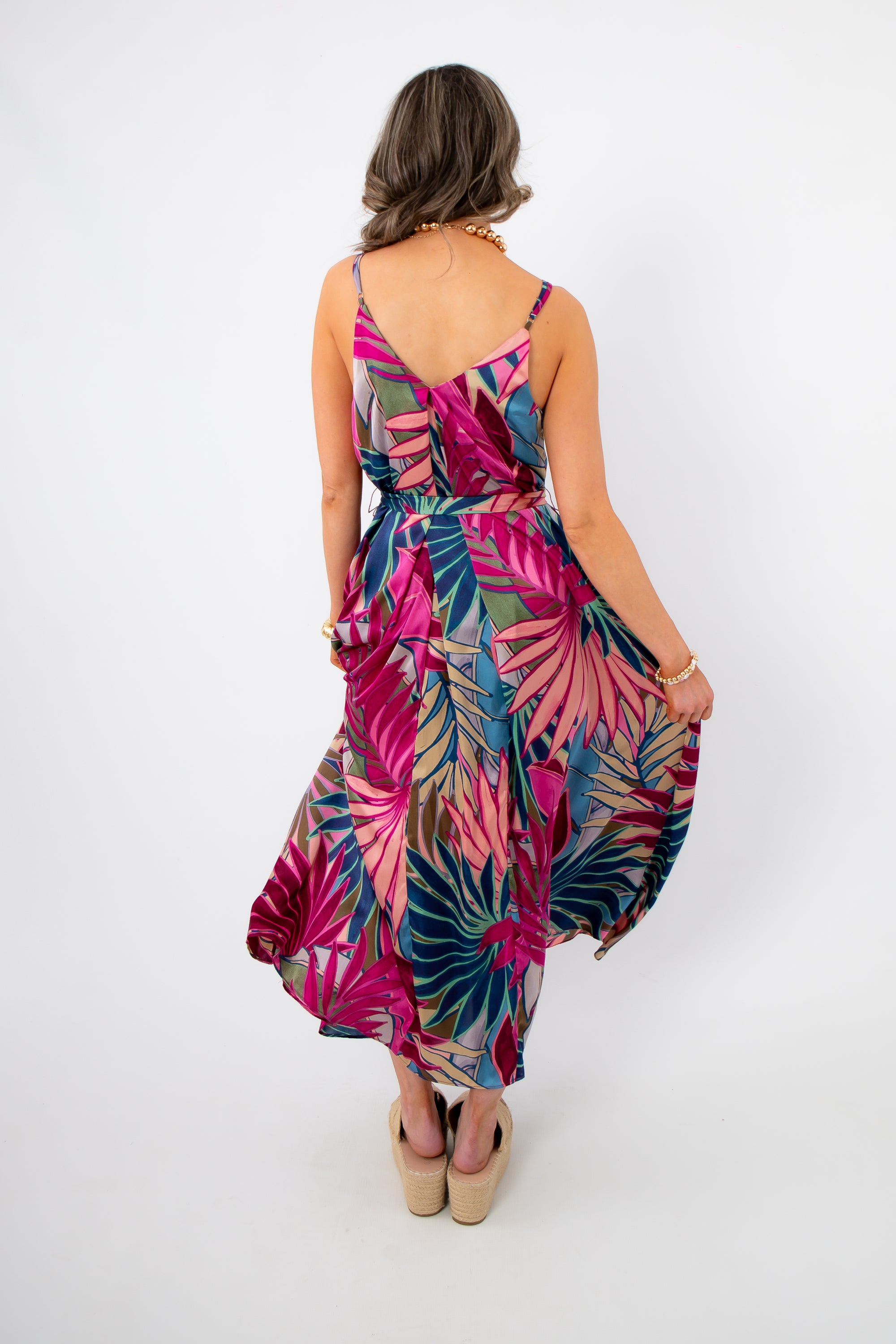 Back view of Tropical Jewel Satin Palm Print Maxi Dress with V-back detail and vibrant tropical pattern, great for warm-weather occasions.