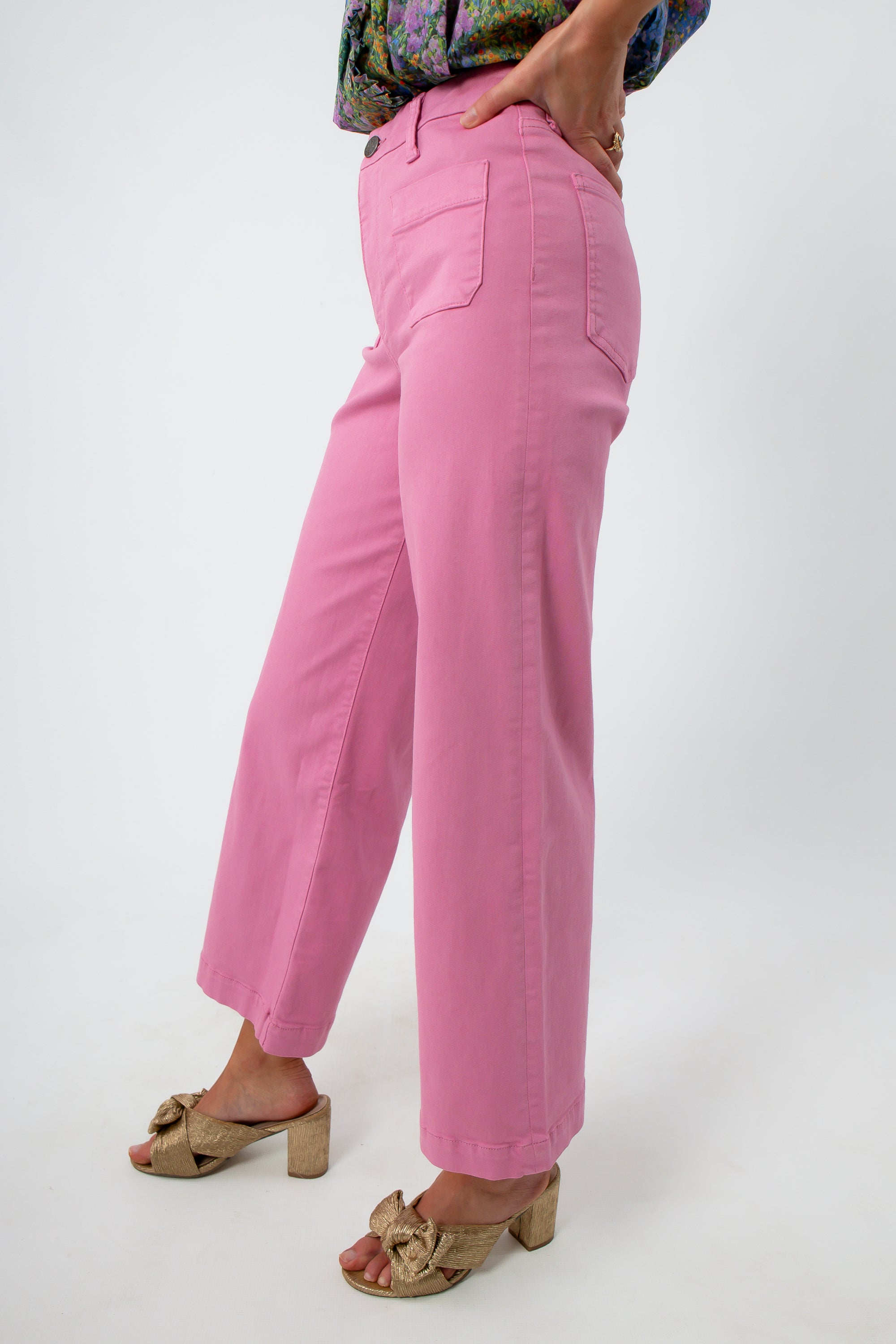 Pink high-rise wide leg denim jeans with model wearing floral top