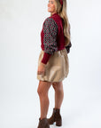 Side view of THML Mixed Media Garnet Knit Shirt with balloon sleeves and relaxed fit. Perfect for layering in fall fashion collections.