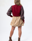 Back view of THML Mixed Media Garnet Top highlighting its solid knit back and patterned sleeves. A trendy and comfortable knitwear piece.