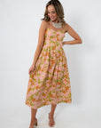 Floral midi dress with pink and orange tulip print, spaghetti straps, and a flowy hem for spring occasions