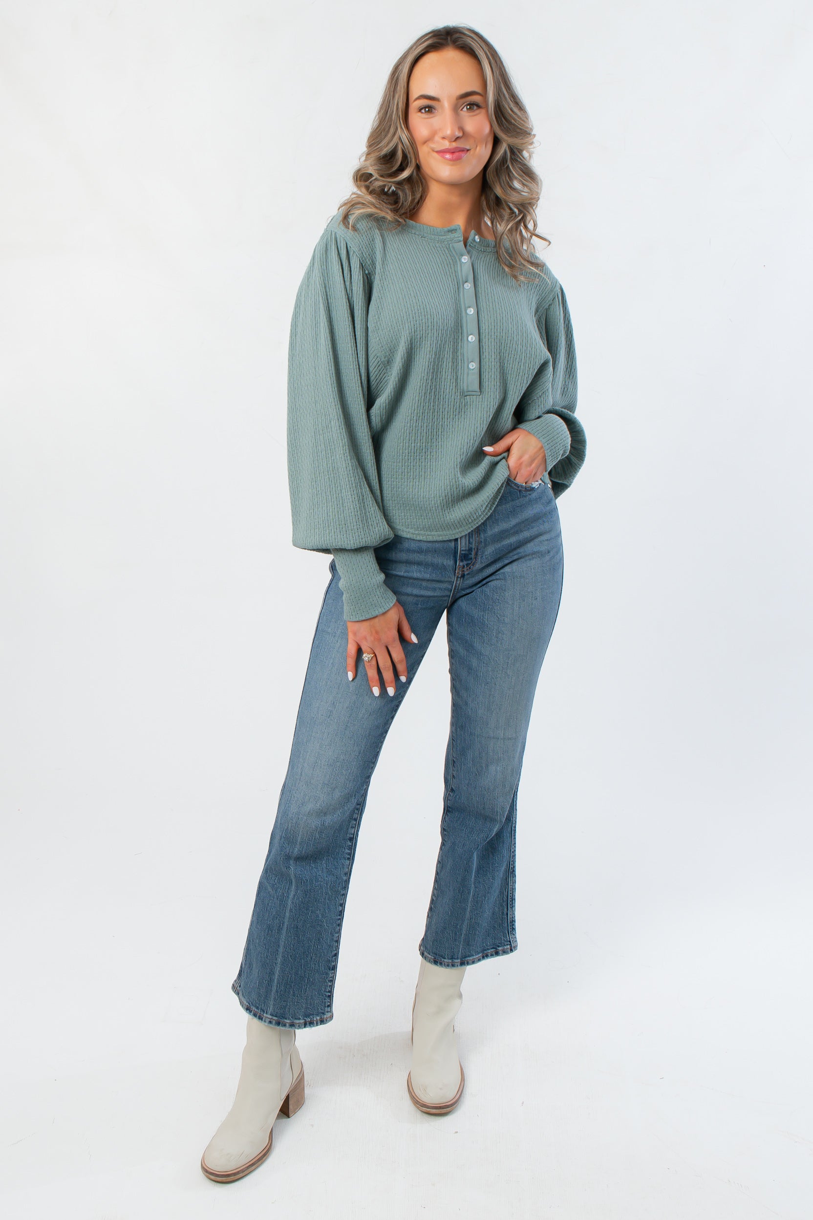 Free People Jade Ash Quinn Knit Thermal – Oversized balloon sleeve henley top in jade ash, styled with denim jeans and white ankle boots.