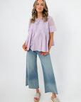 Lacy Lavender Mesh Babydoll Blouse with short sleeves and lace detailing, styled with wide-leg jeans for a chic spring outfit.