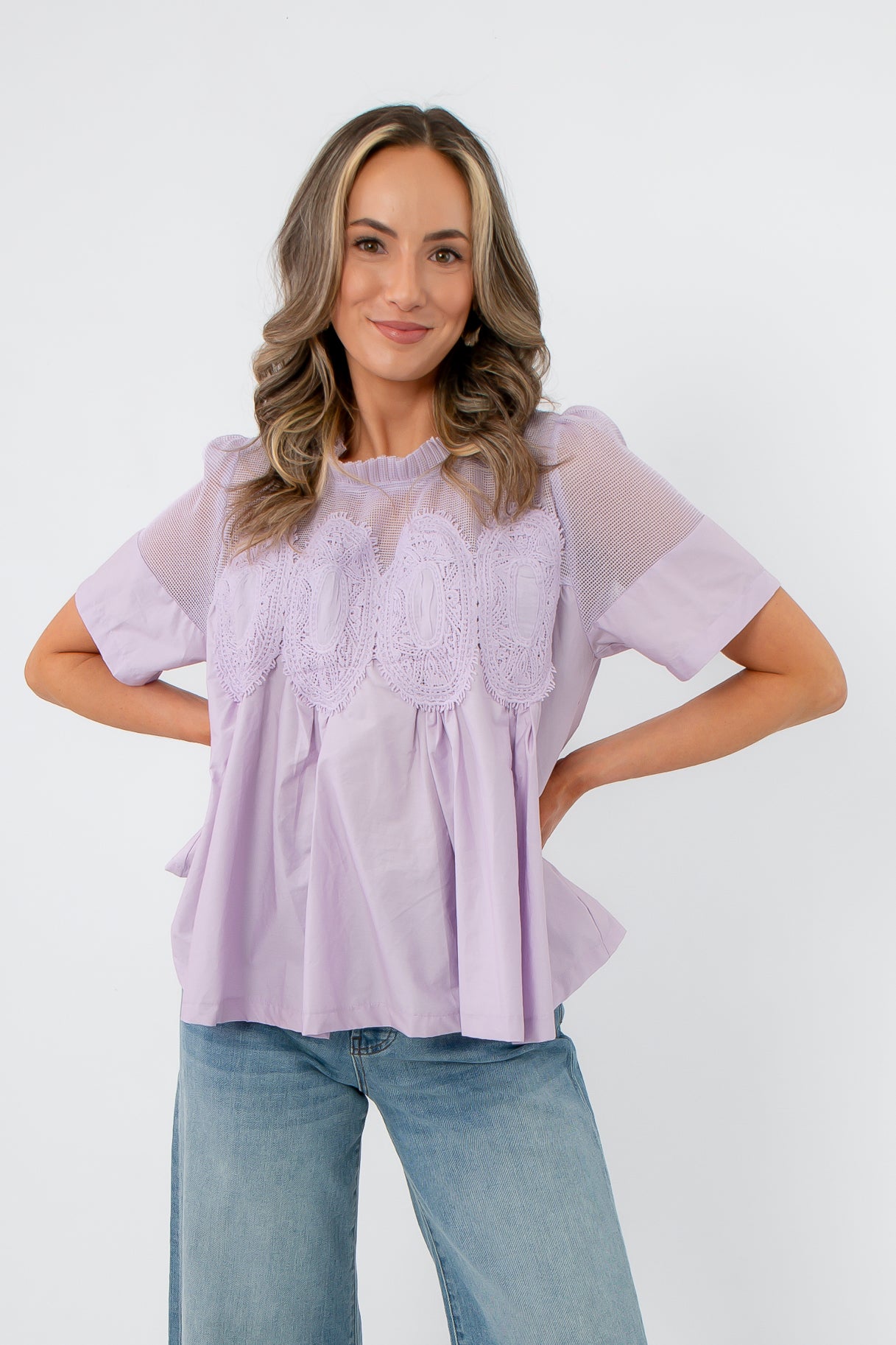 Front view of Lacy Lavender Mesh Babydoll Blouse featuring sheer mesh yoke and intricate lace accents, perfect for spring workwear.