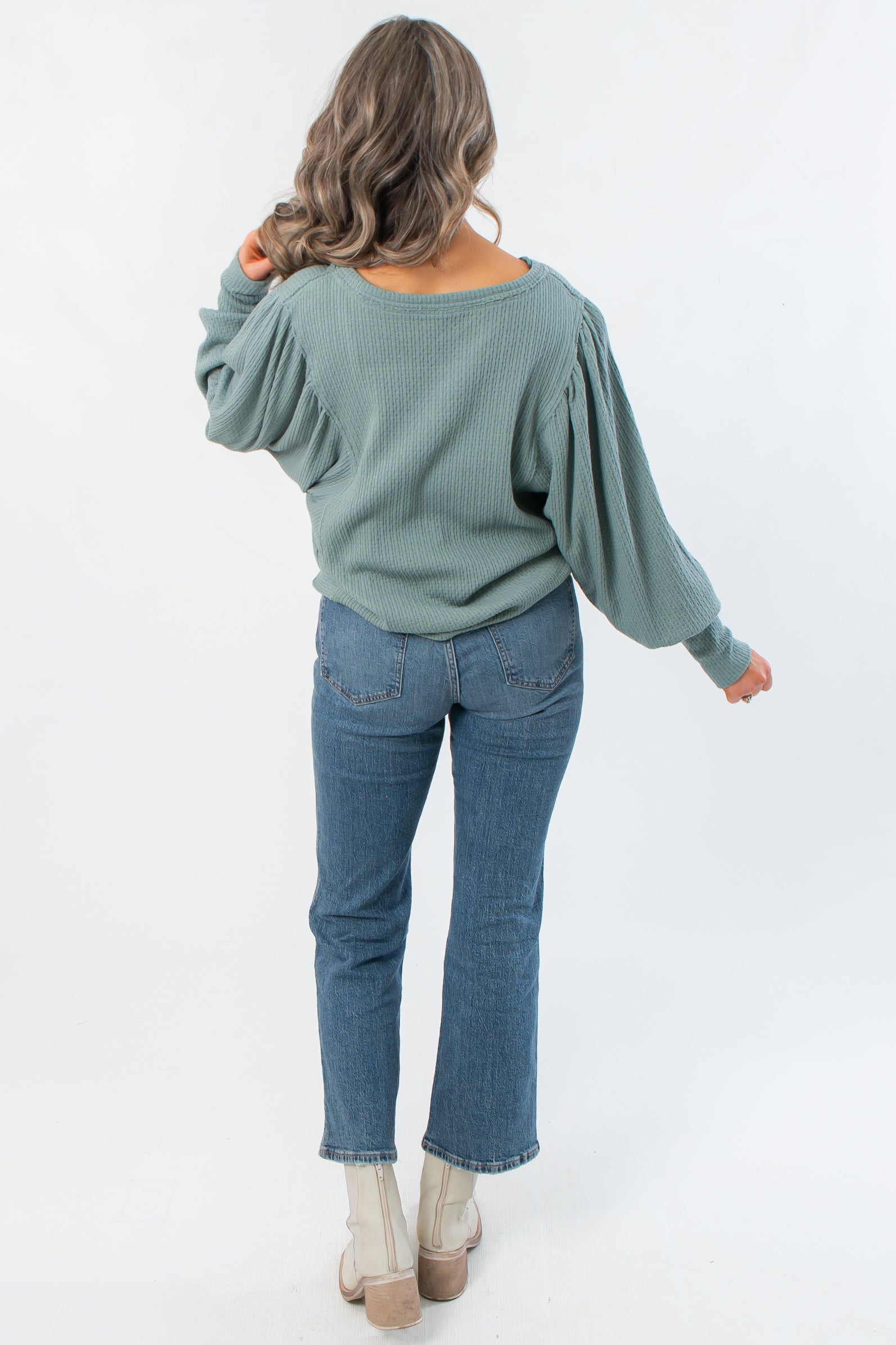 Back view of Free People Jade Ash Quinn Knit Thermal showcasing relaxed fit and textured knit design, perfect for casual layering looks.