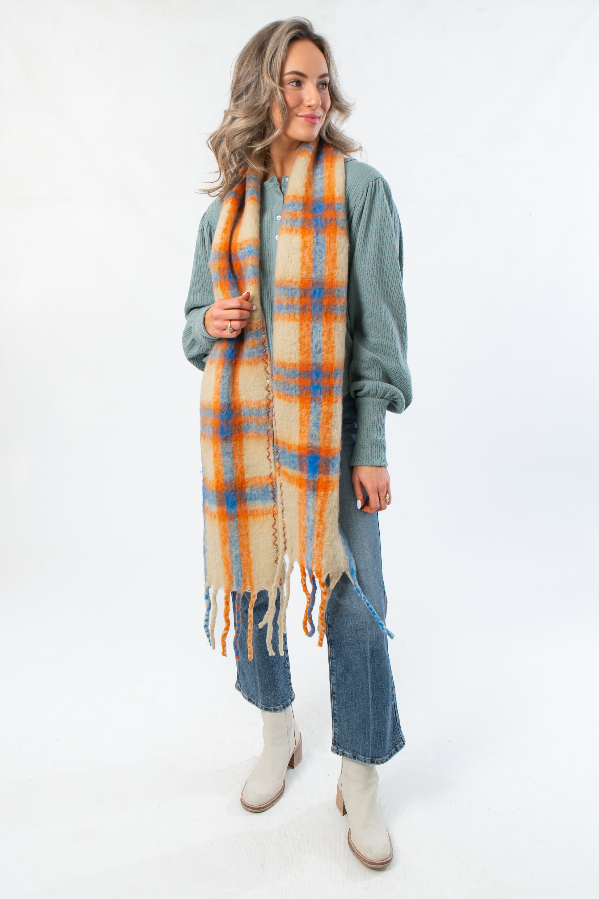 Free People Highland Plaid Embellished Scarf styled with fall outfit. Lightweight tartan scarf in orange, blue, and beige for seasonal layering.