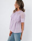 Side profile of Lacy Lavender Mesh Babydoll Blouse showing flowy silhouette and airy mesh fabric ideal for spring styling.