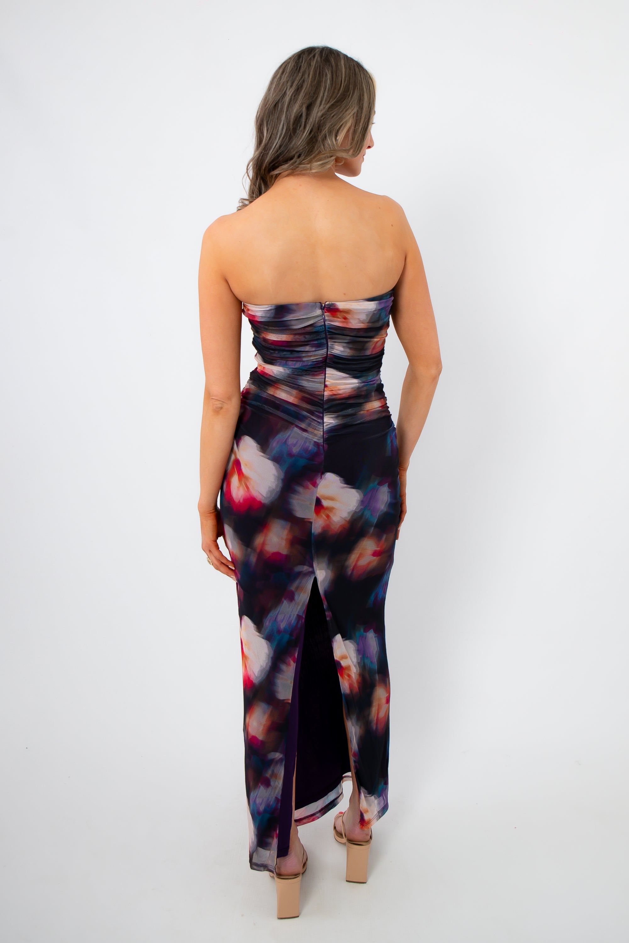Back view of Amethyst Petal Mesh Maxi Dress with ruched detailing and back slit, showcasing a flattering fit for elegant spring and summer events.