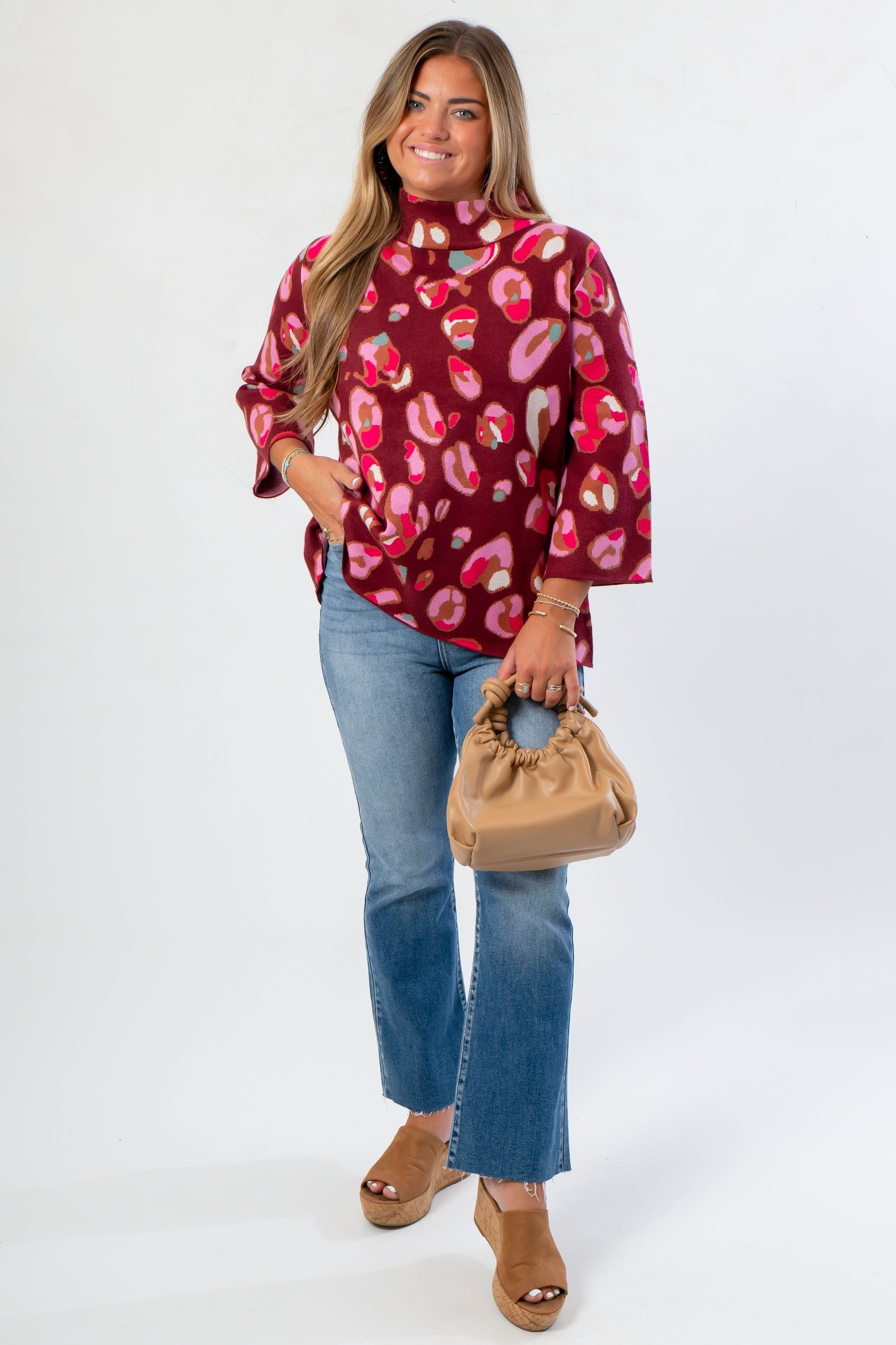 Animal Print Mock Neck Sweater - Fashionable Attire in multicolor with bold leopard pattern, styled with jeans and tan accessories for a trendy look.