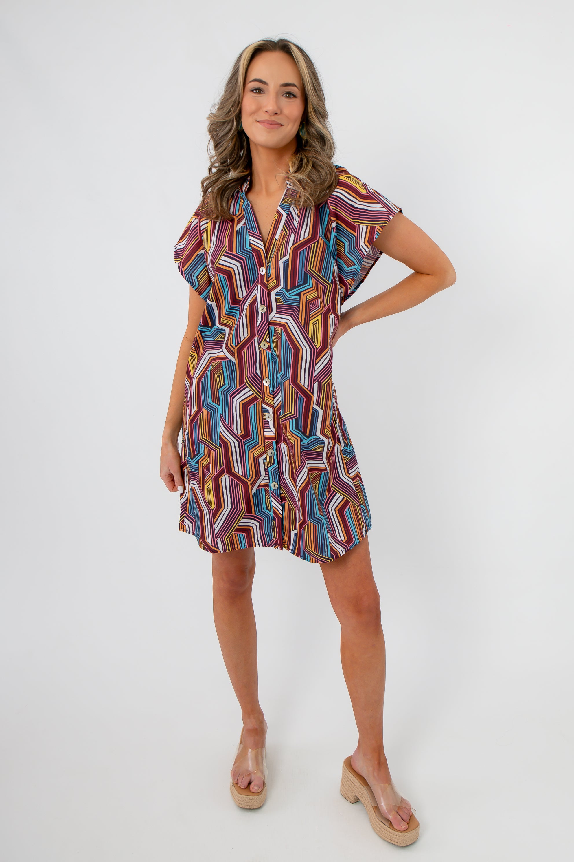 Front view of THML Tropadelic Short Sleeve Dress featuring colorful tropical print, short sleeves, and easy shift silhouette for casual wear.