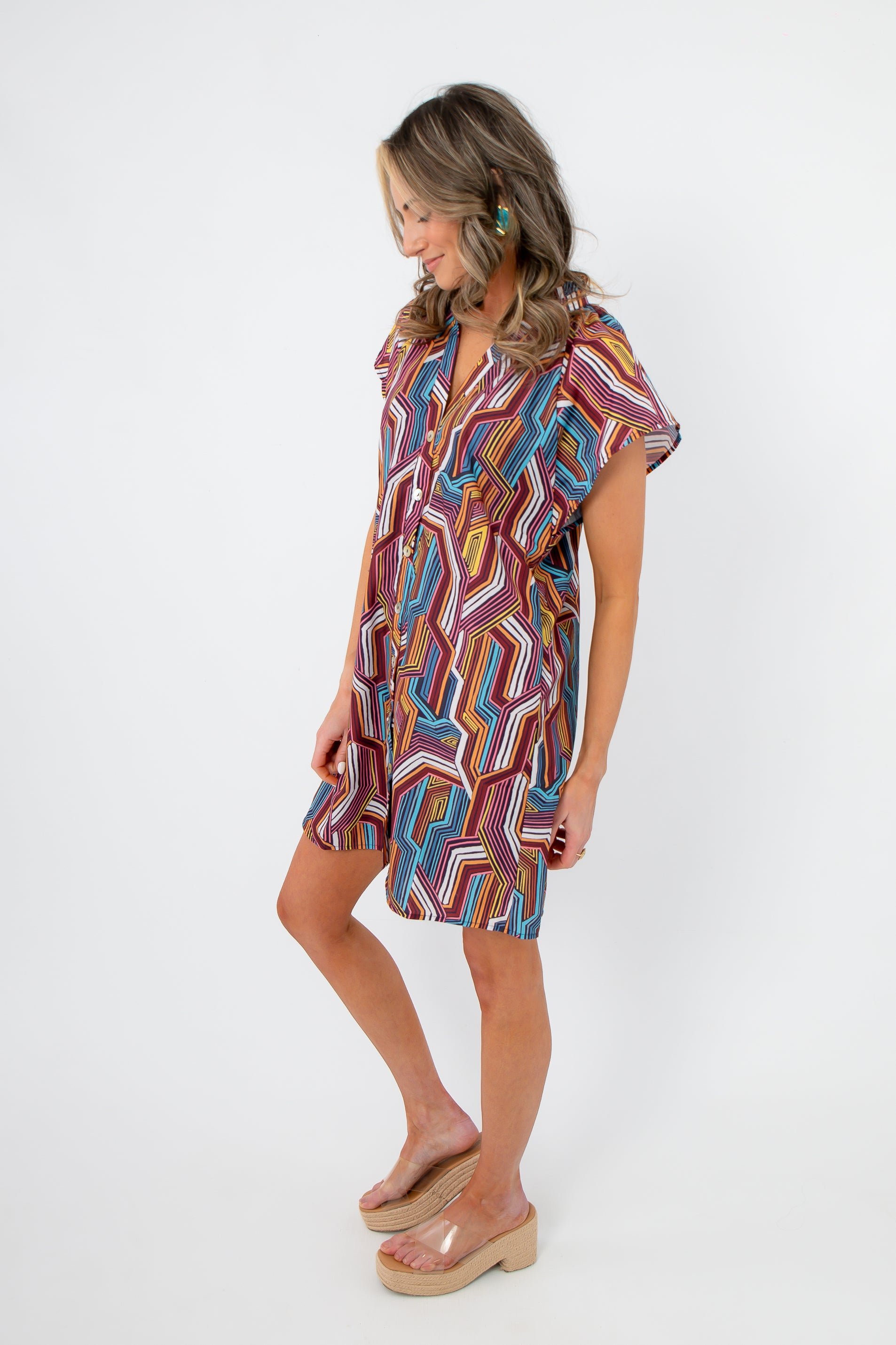 Angled view of THML Tropadelic Short Sleeve Dress with tropical multicolor print and casual short sleeve design perfect for spring.