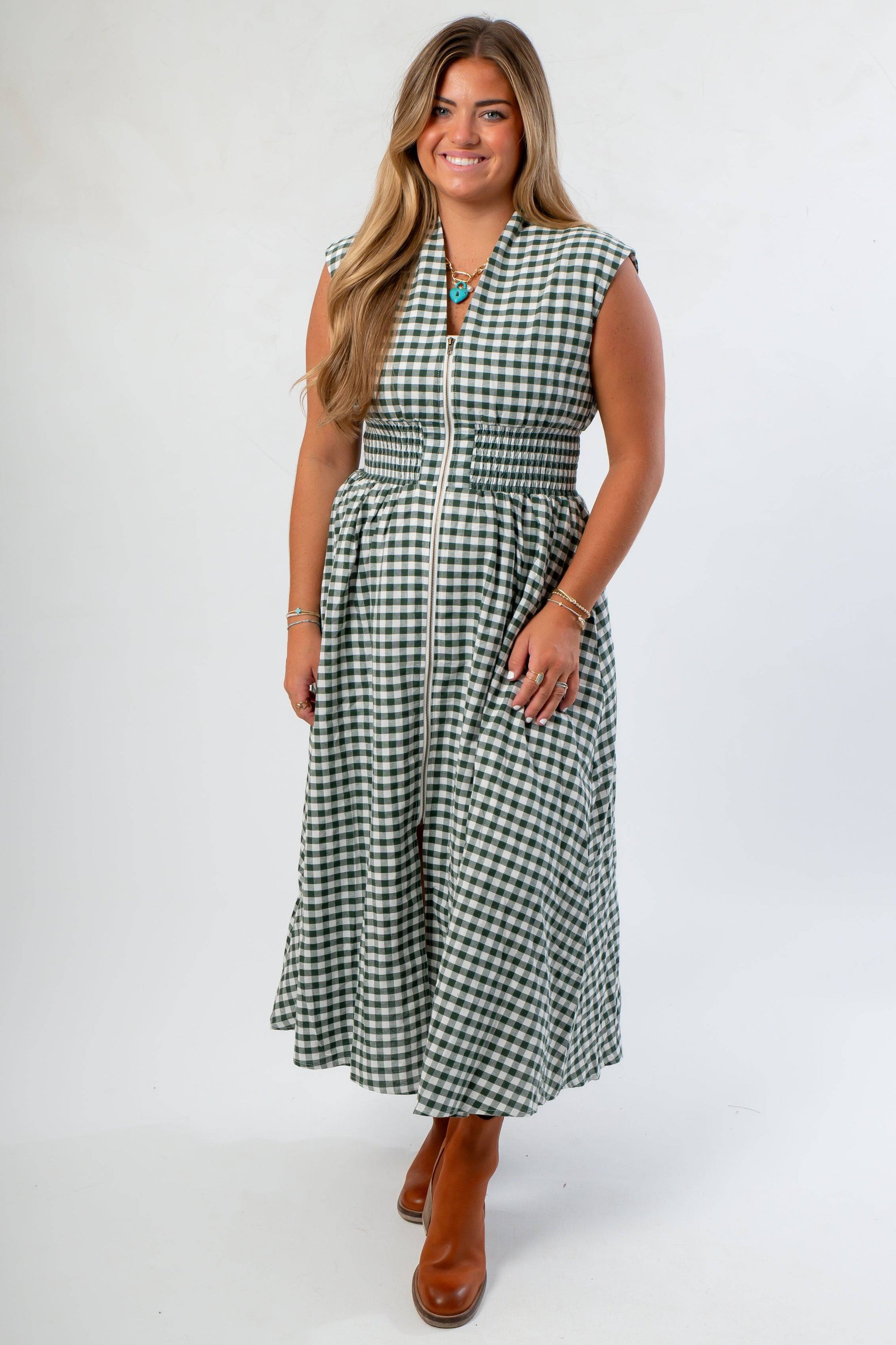 Patch Season Green Gingham Front Zip Midi Dress with v neckline, smocked waist, and cap sleeves styled for pre-fall with ankle boots.